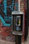 Street View with Graffiti Pay Phone Stand