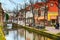 Street view with houses and canal in Delft, Holland