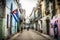 Street view on La Habana Vieja with cuban flag, La Habana, Cuba