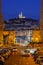 Street view and the old port and basilica of notre dame de la garde at night in Marseille, France