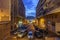 Street view and the old port and basilica of notre dame de la garde at night in Marseille, France