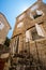 street view of the old town of Budva in Montenegro, medieval European architecture, narrow city streets, windows with wooden