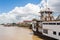 Street view in Paramaribo, Surinam with wooden colonial houses and river