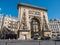 Street view of Porte Saint Denis, triumphal arch, Paris