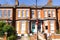 Street view of red brick terrace homes