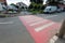 Street view, red pedestrian crossing in the city center.