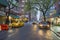 Street view of St Marks Place with cars and people walking in raining day in Manhattan, New York City