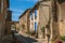 Street view with stone houses in the city center of Chateauneuf-du-Pape hamlet.