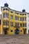 Street view to a yellow building of a modern design in Linz in A