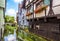 Street with vintage half-timbered houses in old town of Ulm, Germany. Medieval Fish Quarter is tourist attraction of Ulm