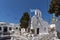 Street whit white houses in town of Mykonos, Greece