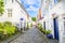 Street with white wooden houses in old centre of Stavanger. Norway.