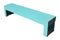The street wooden bench for rest is painted in a naive light blu
