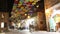 Street Yoel Moshe Salomon in Jerusalem, in the historic Nahalat Shiva district at night, decorated with brightly colored umbrellas