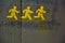 Streetart, three running yellow man picto