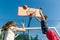 Streetball basketball game with two players, teenagers girl and boy, morning on basketball court.