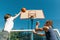Streetball basketball game with two players, teenagers girl and boy, morning on basketball court