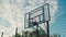 Streetball player dunking on outdoor court at dawn