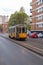 Streetcar, lightrail tram carrying passengers within the city of Milano, Italy