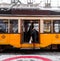 Streetcar, lightrail tram carrying passengers within the city of Milano, Italy