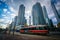 Streetcar on Queens Quay West and modern buildings at the Harbourfront, in downtown Toronto, Ontario.