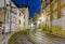 Streetcar rails in the old part of Lisbon by night