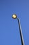 Streetlamp against blue sky