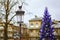 Streetlamp and Christmas tree in the background