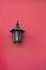 streetlamp lantern on pink wall, copy space. streetlamp lantern on house. streetlamp lantern outdoor.