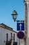 Streetlamp - lantern, traffic signs and a blue sky