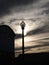 Streetlight Silhouette At Dusk