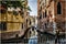 Streets and canals of Venice, Italy Ancient houses , flowers in the windows and the sea