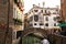 Streets and canals of Venice, Italy Ancient houses , flowers in the windows and the sea