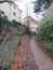 Streets of Mason. Cobblestone, On the right is the city wall, on the left are ancient buildings.