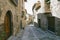 Streets with rustic houses built with stones and decorated with flowers.