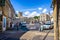 Streets and shops and market cross in historic cotswold town of Stow on the Wold