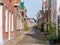 Streetscene of narrow Midstrjitte in Waldsein, Woudsend, Friesland, Netherlands