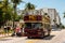 Streetview of the historical Art Deco District of Miami South Beach with a hop-on hop-off tourist bus