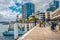 Streetview of King street wharf with people and modern international tower buildings in background in Sydney NSW Australia