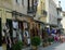 Streetview of outdoor shopping market with people walking in Athens, Greece