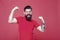 Strength and drive. Bearded man show strength. Strong hipster flex arms red background. Strength and confidence