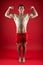 Strength and motivation. fit your body and lose weight. Sport and fitness. Athlete or sportsman in red shorts. Athlete