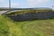 Strengthening the steep slope. A fragment of the retaining wall