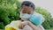 Stress asian little girl holding toy bear wearing medical protective mask