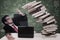 Stress businessman with falling books at class