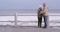 Stress, comfort and sad senior couple with mental health, depression and anxiety at beach. Stressed, worried and