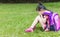 Stress girl sitting on the grass