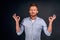 Stress goes away with meditation. Portrait of charming relaxed and calm european man with redbeard and moustache in blue shirt,