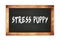 STRESS  PUPPY text written on wooden frame school blackboard