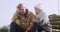 Stress, support and senior couple on outdoor stairs in grief, hug and anxiety in retirement. Marriage, trust and love on